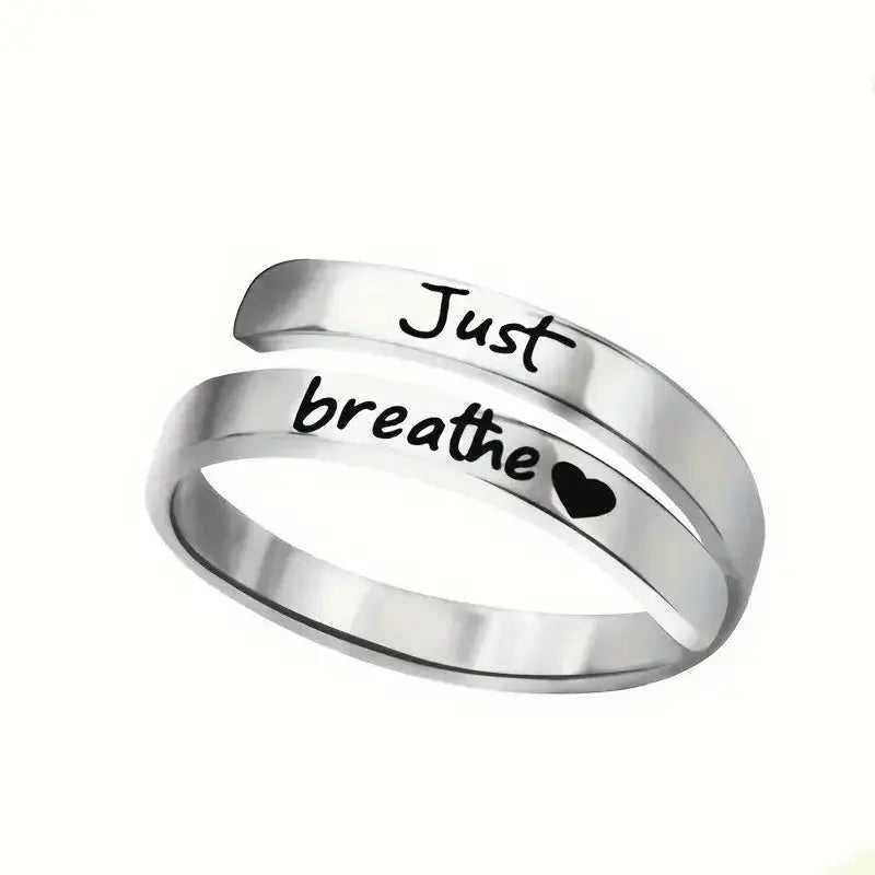 Silver stainless steel spiral heart ring engraved with Just Breathe for mindful fashion