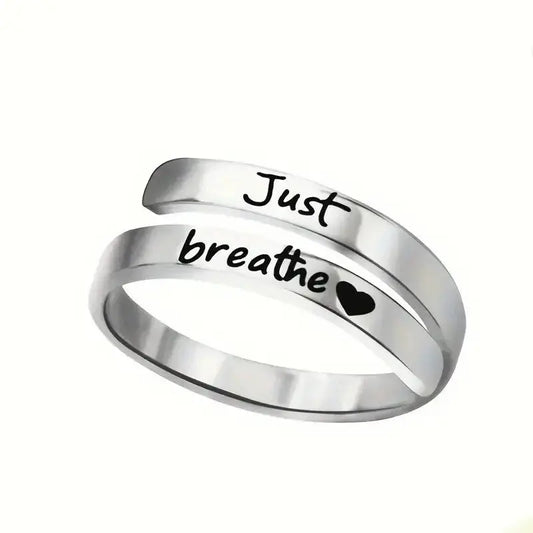 Silver stainless steel spiral heart ring engraved with Just Breathe for mindful fashion